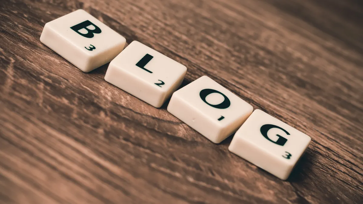 How to choose AI blogging software for a business website — Blog Letters on Brown Wood