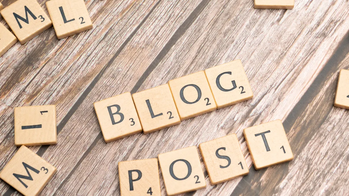 What should be automated in a business blog content workflow? — Blog post with scrabble letters spelling out blog post